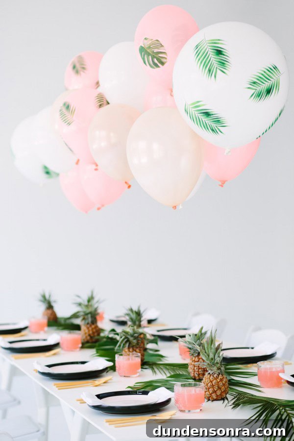 Palm Frond Balloons Palm frond balloons attached to a table.