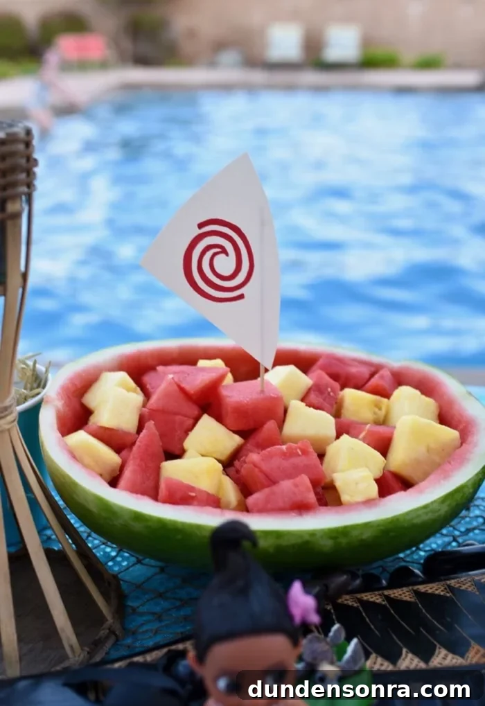 Moana Watermelon Boat Watermelon boat filled with watermelon and pineapple topped with a small boat sail.