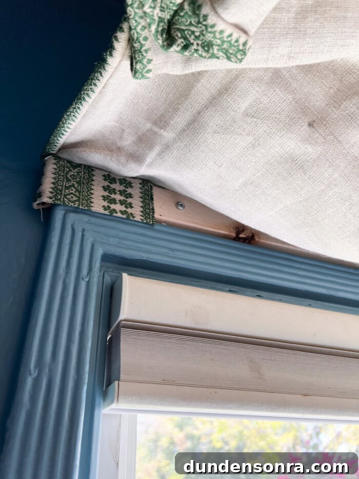 close up of shade hung above window