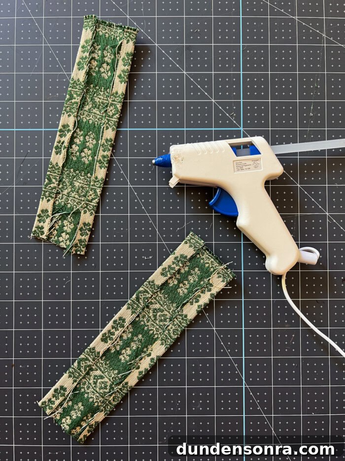 small pieces of fabric next to glue gun