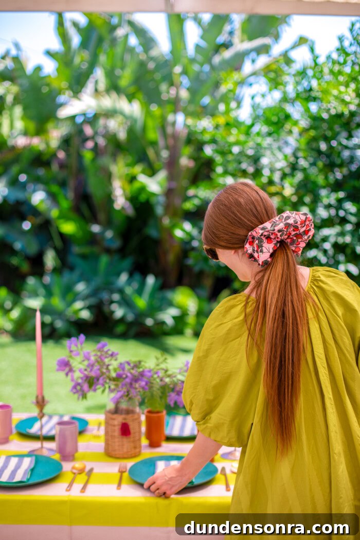 woman wearing oversized scrunchie decorating a table