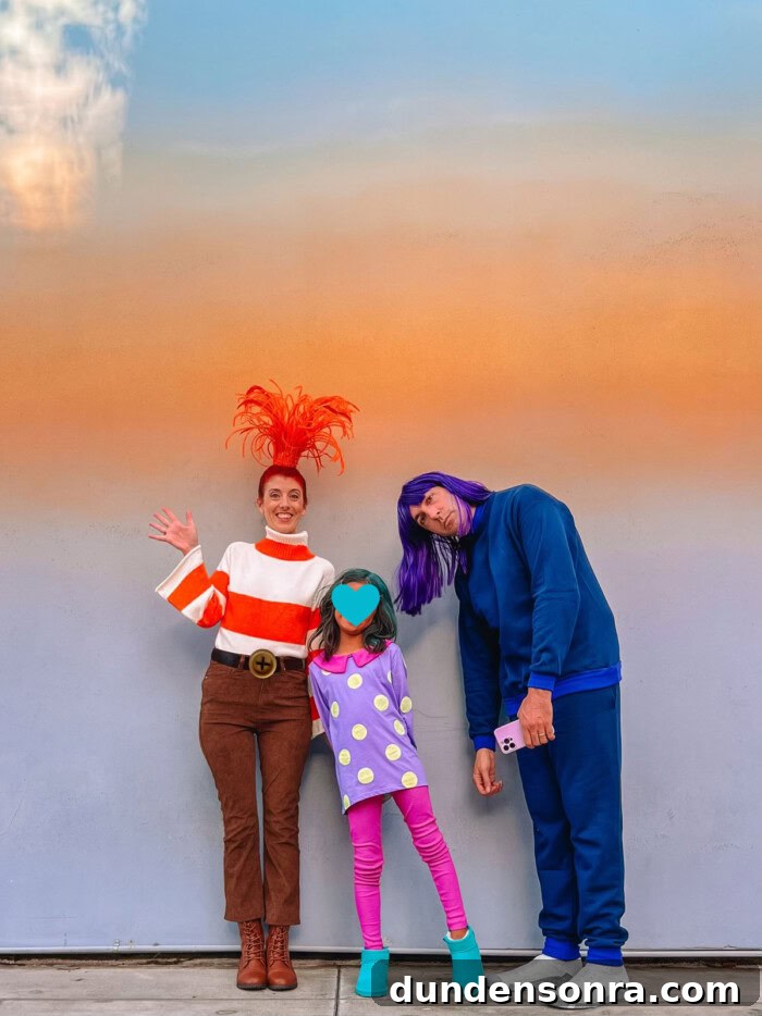 Family wearing Inside Out 2 costumes in front of ombre wall