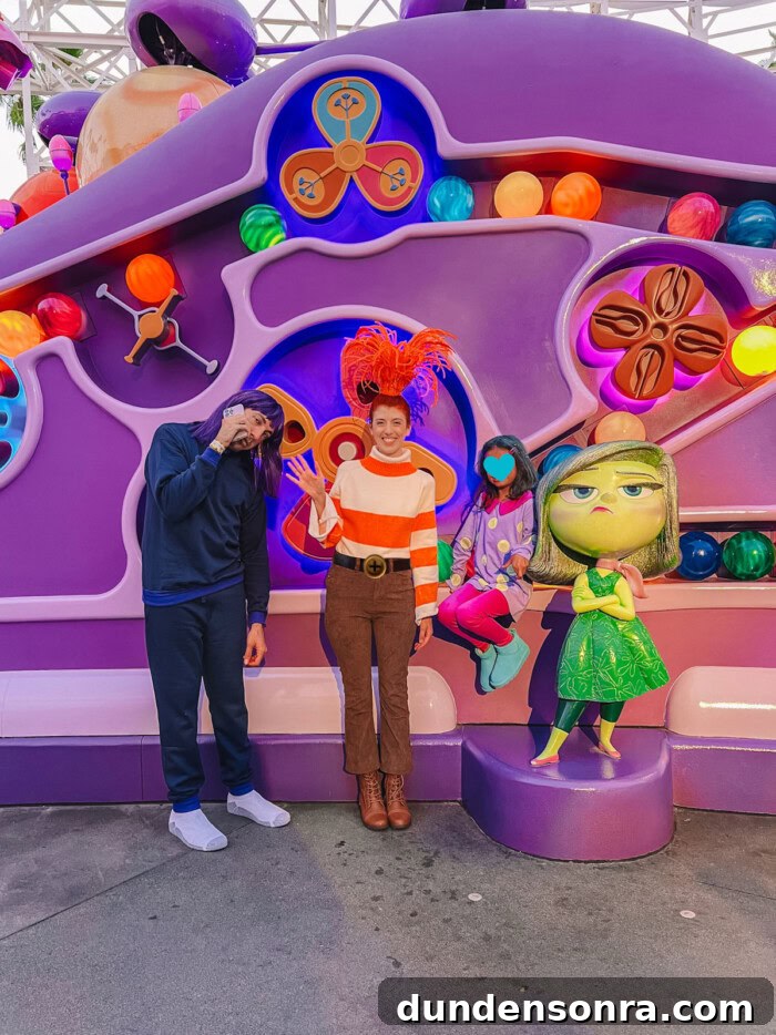 Inside Out 2 costumes in front of Inside Out 2 ride at Disneyland
