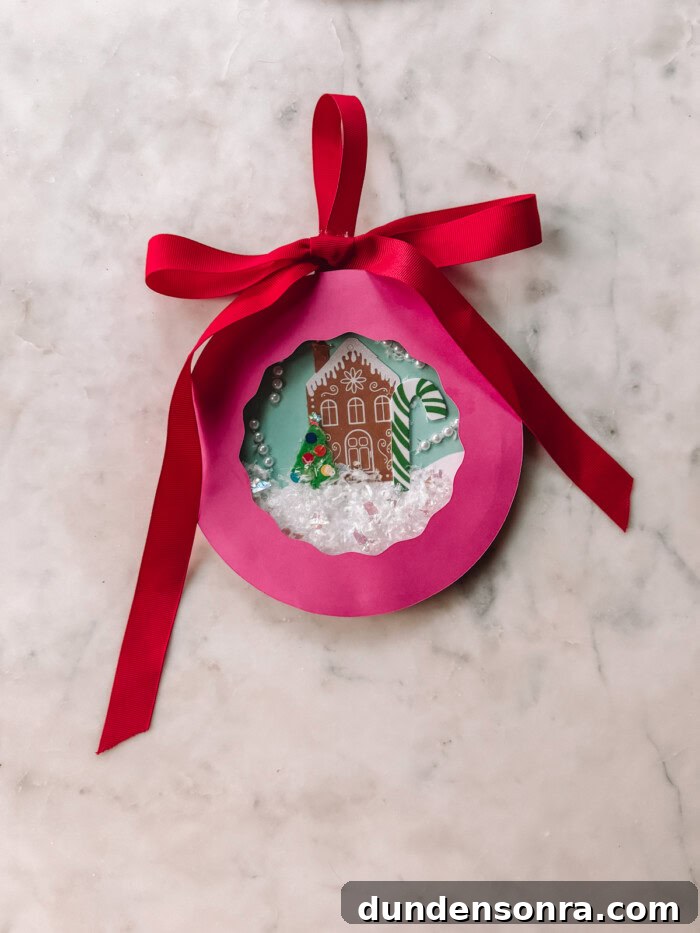Pink paper plate snow globe