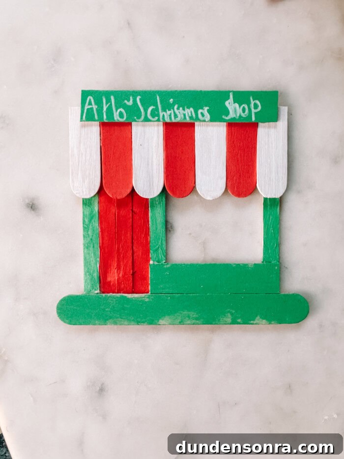 DIY Popsicle Stick Storefront Ornaments: Charming Mini Shop Decor 11 painted popsicle storefront