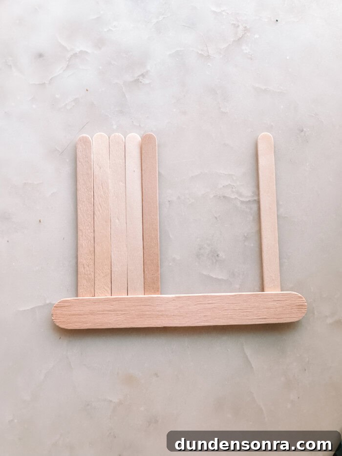 DIY Popsicle Stick Storefront Ornaments: Charming Mini Shop Decor 4 Popsicle sticks on marble
