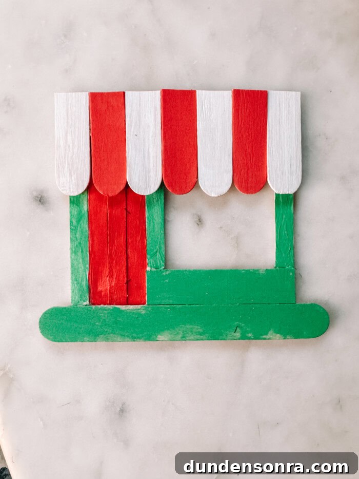 DIY Popsicle Stick Storefront Ornaments: Charming Mini Shop Decor 10 painted popsicle storefront