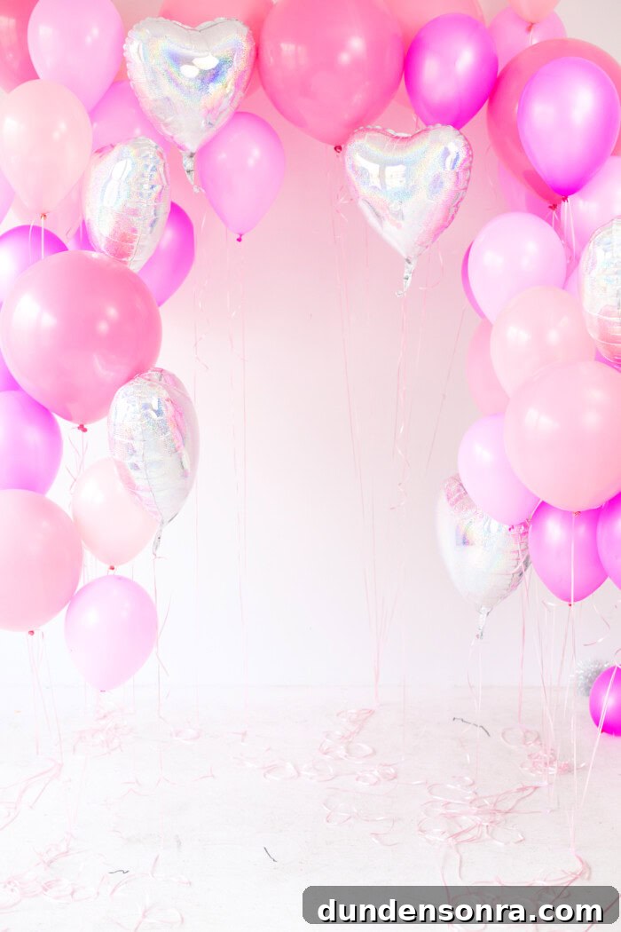 Creative Valentine's Day Classroom Party Ideas for Every Grade 13 pink balloon backdrop