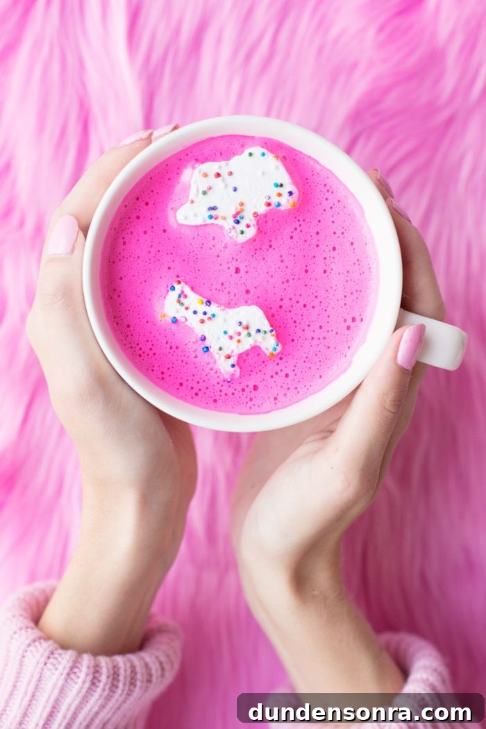 Creative Valentine's Day Classroom Party Ideas for Every Grade 16 Someone holding a mug with a pink substance in it