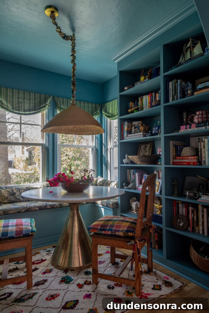 colorful dining room with blue walls and plaid cushions
