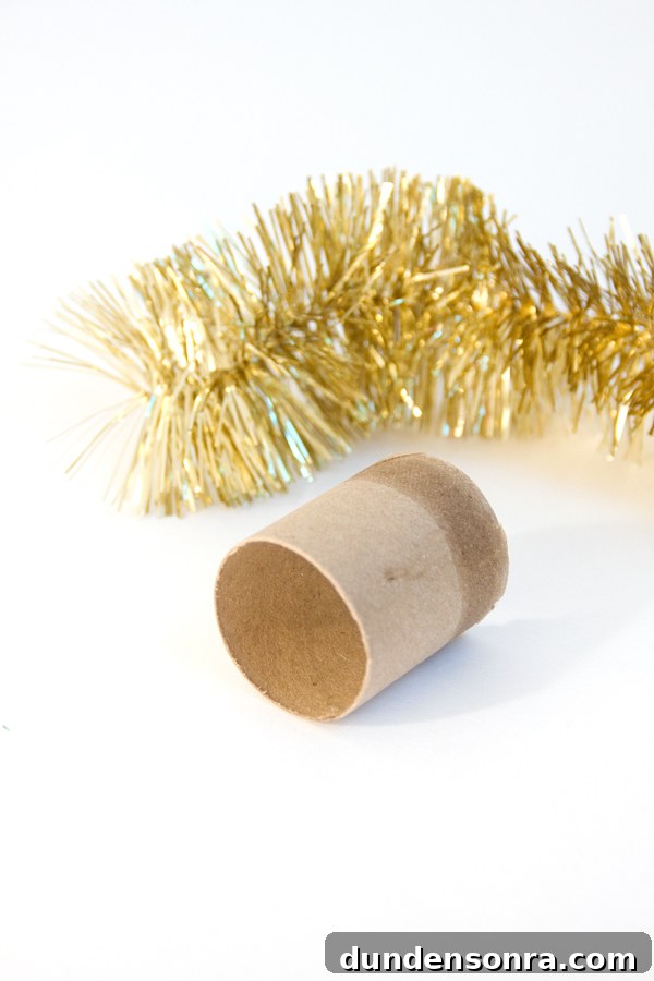 Attaching tinsel to cardboard tube for bulb top